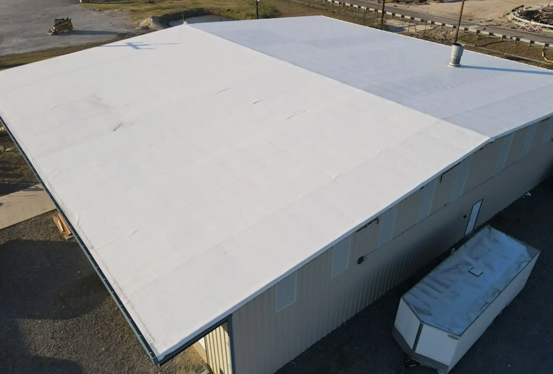White PVC membrane on a flat commercial roof – TPO roofs project gallery