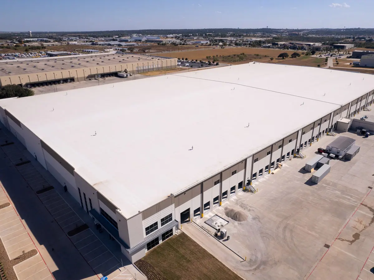 Aerial view of a large warehouse with a finished white TPO roof – TPO roofs project gallery