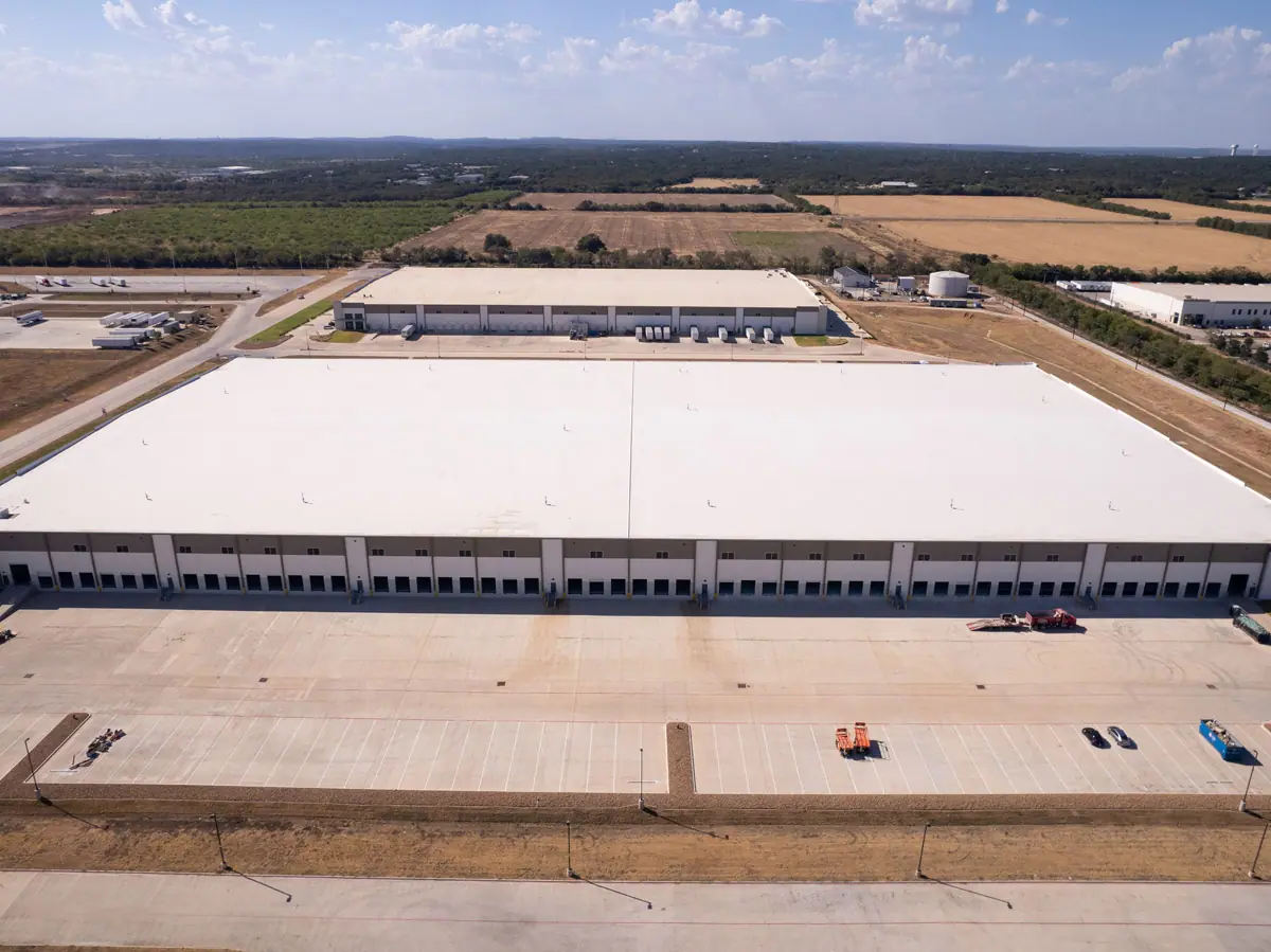 Aerial view of a large warehouse with a finished white TPO roof – TPO roofs project gallery