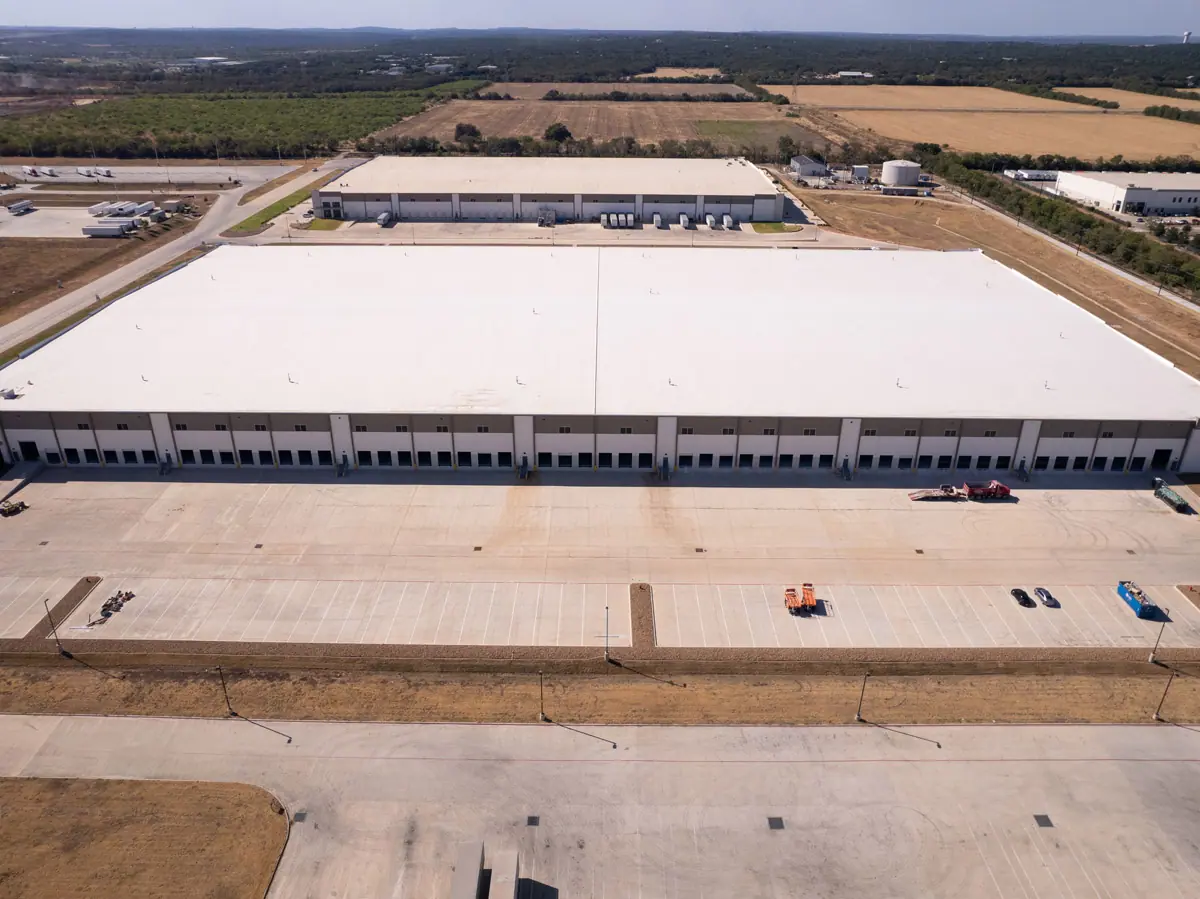 Aerial view of a large warehouse with a finished white TPO roof – TPO roofs project gallery