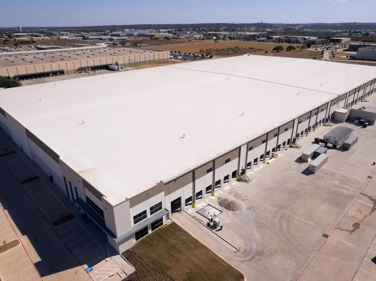 Aerial view of a large warehouse with a finished white TPO roof – TPO roofs project gallery
