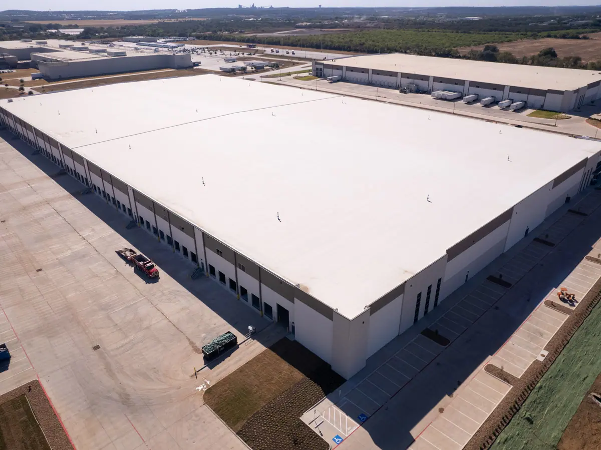 Aerial view of a large warehouse with a finished white TPO roof – TPO roofs project gallery