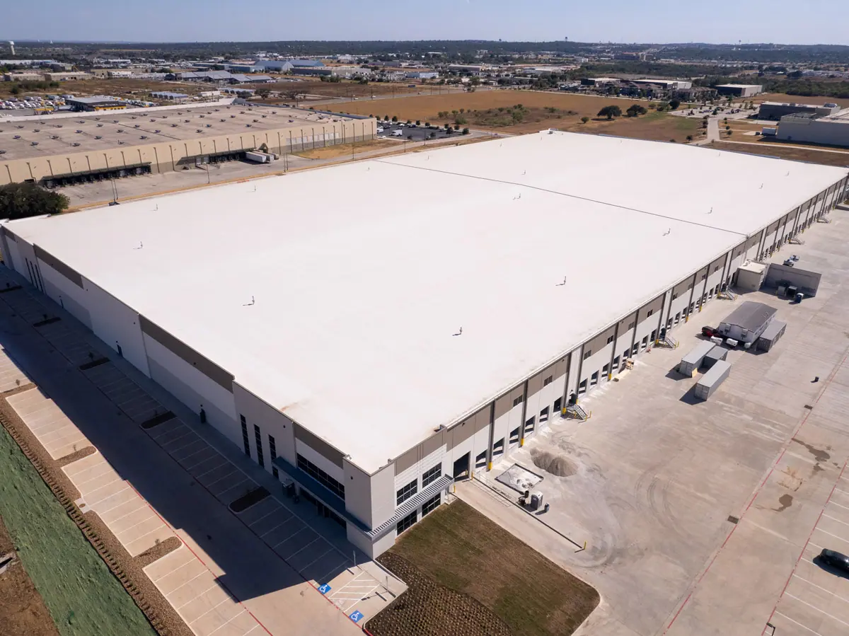 Aerial view of a large warehouse with a finished white TPO roof – TPO roofs project gallery
