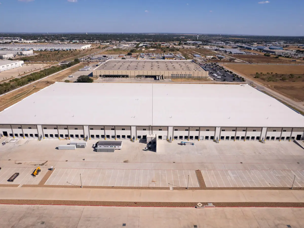 Aerial view of a large warehouse with a finished white TPO roof – TPO roofs project gallery