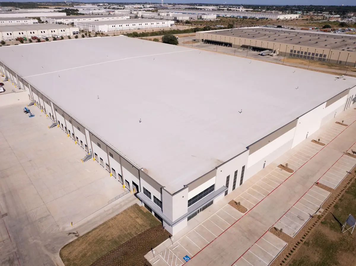 Aerial view of a large warehouse with a finished white TPO roof – TPO roofs project gallery