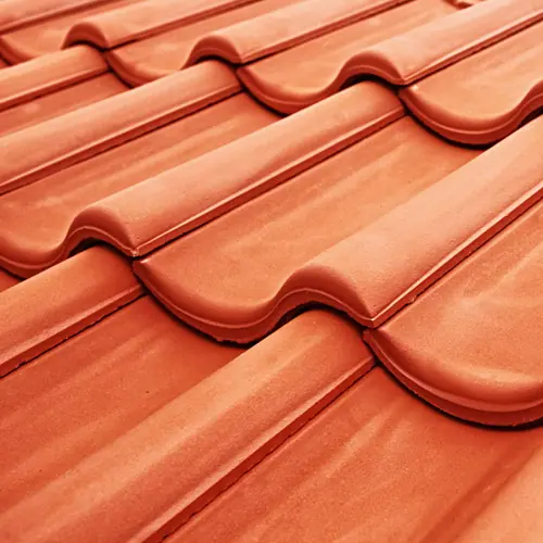 Close-up of orange clay roof tiles – Waco roofing company
