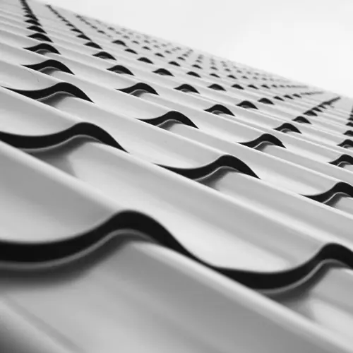 Close-up of silver metal tile roofing – Waco roofing company